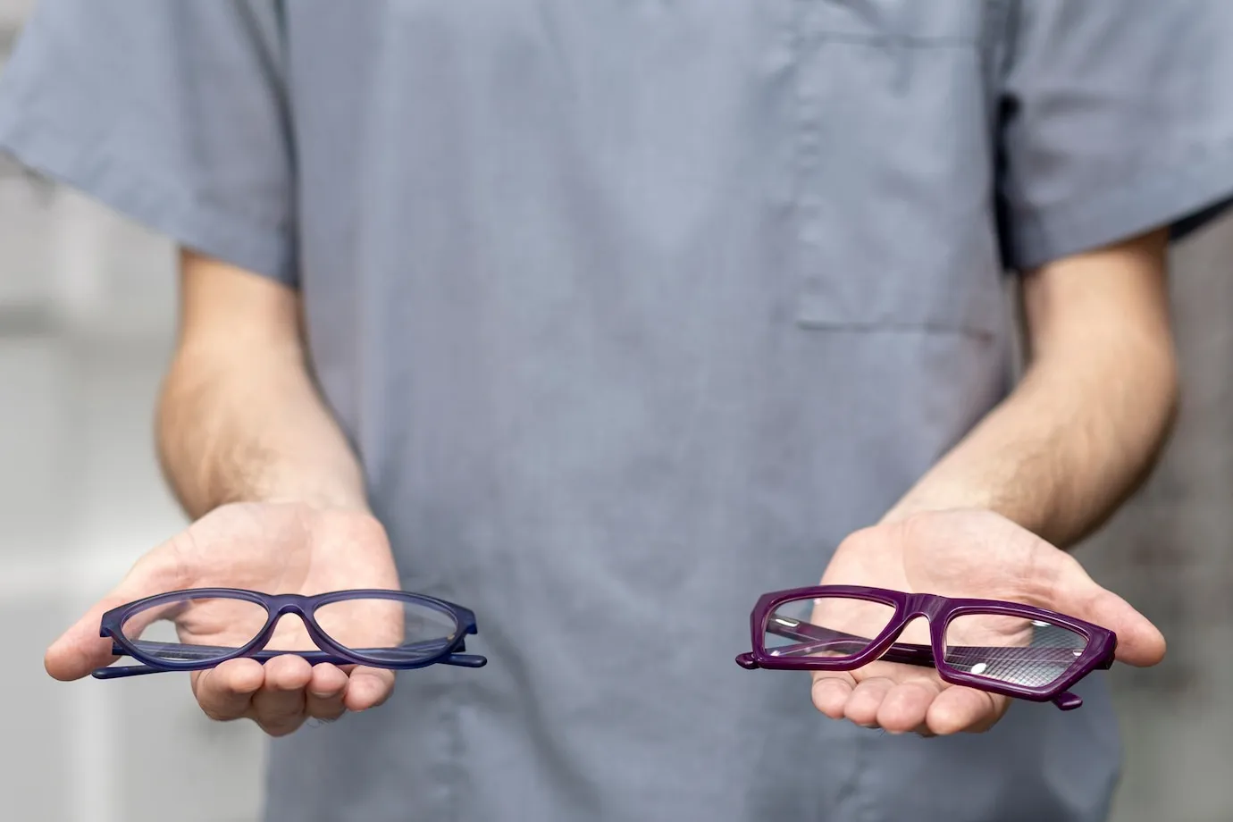 front-view-man-holding-pair-glas